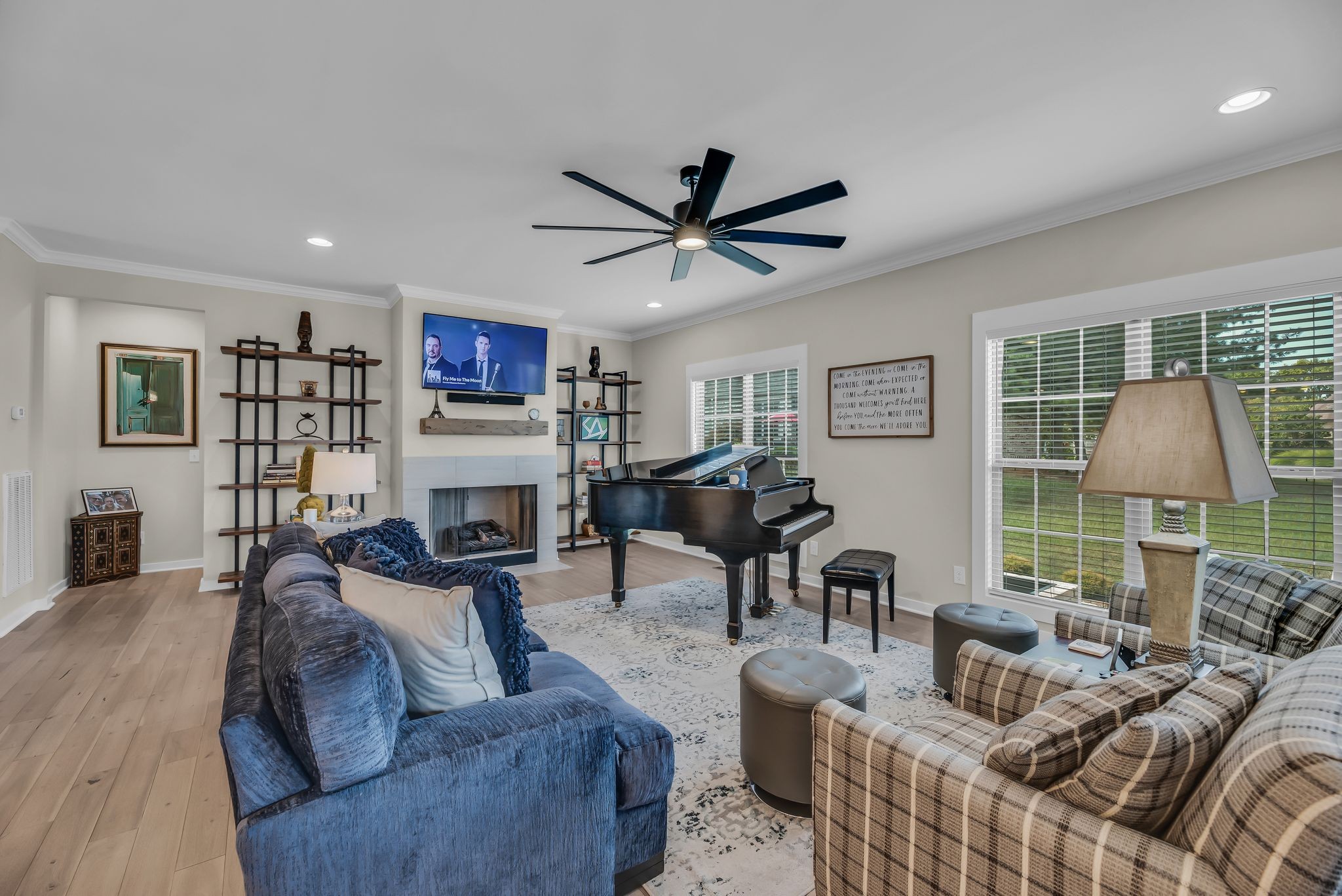 120 Augusta Trail Springfield, TN 37172 - Photo 15 of 37 a living room with furniture a fireplace and a flat screen tv