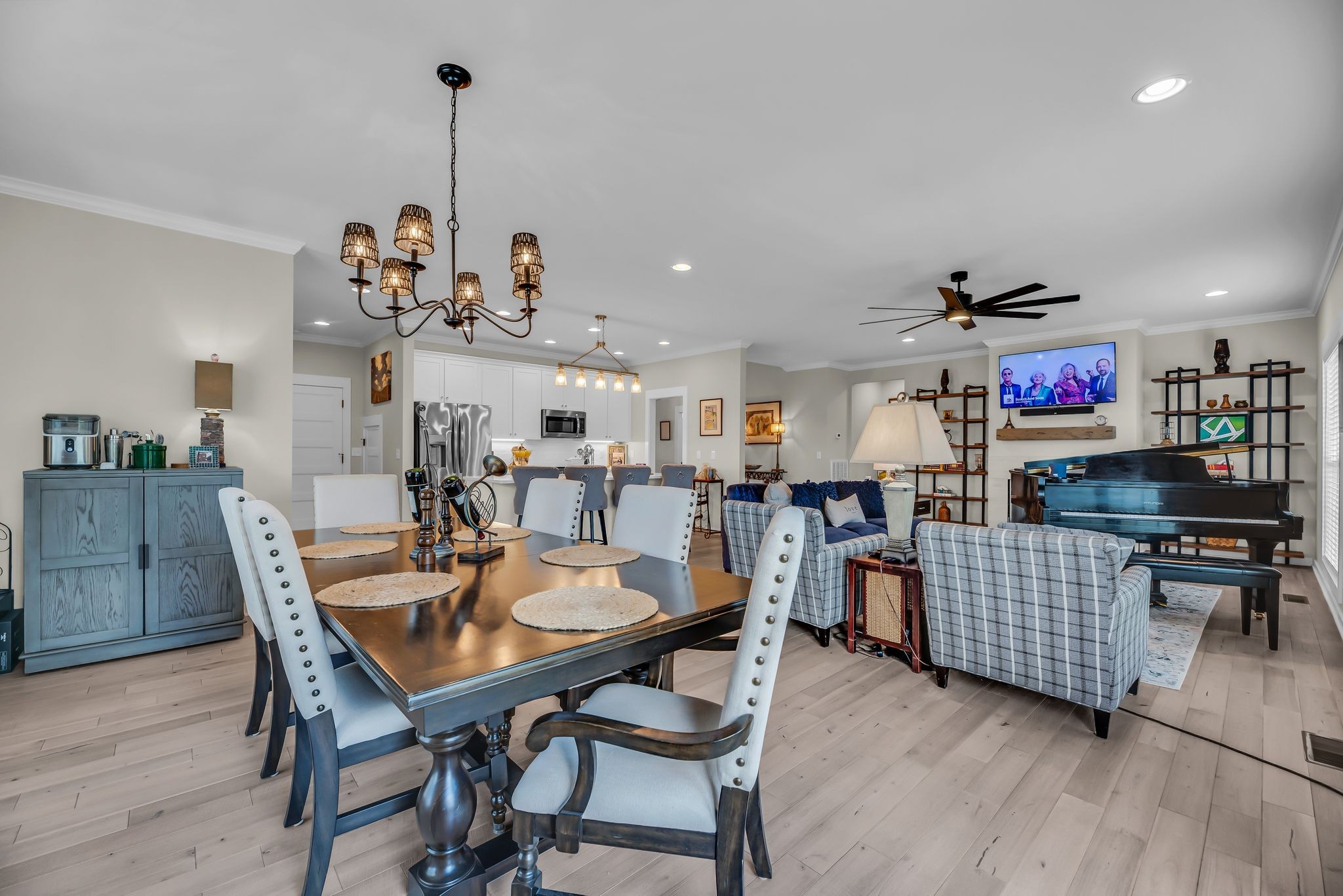 120 Augusta Trail Springfield, TN 37172 - Photo 19 of 37 a view of a dining room and livingroom with furniture wooden floor a rug a painting and a chandelier