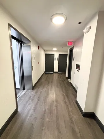 a view of parking garage with cars