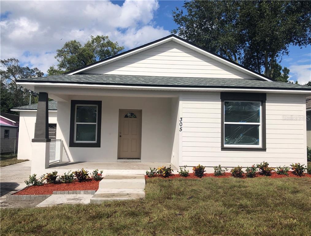 305 West 9th Street Lakeland, FL 33805 - Photo 1 of 1 a front view of a house with a yard