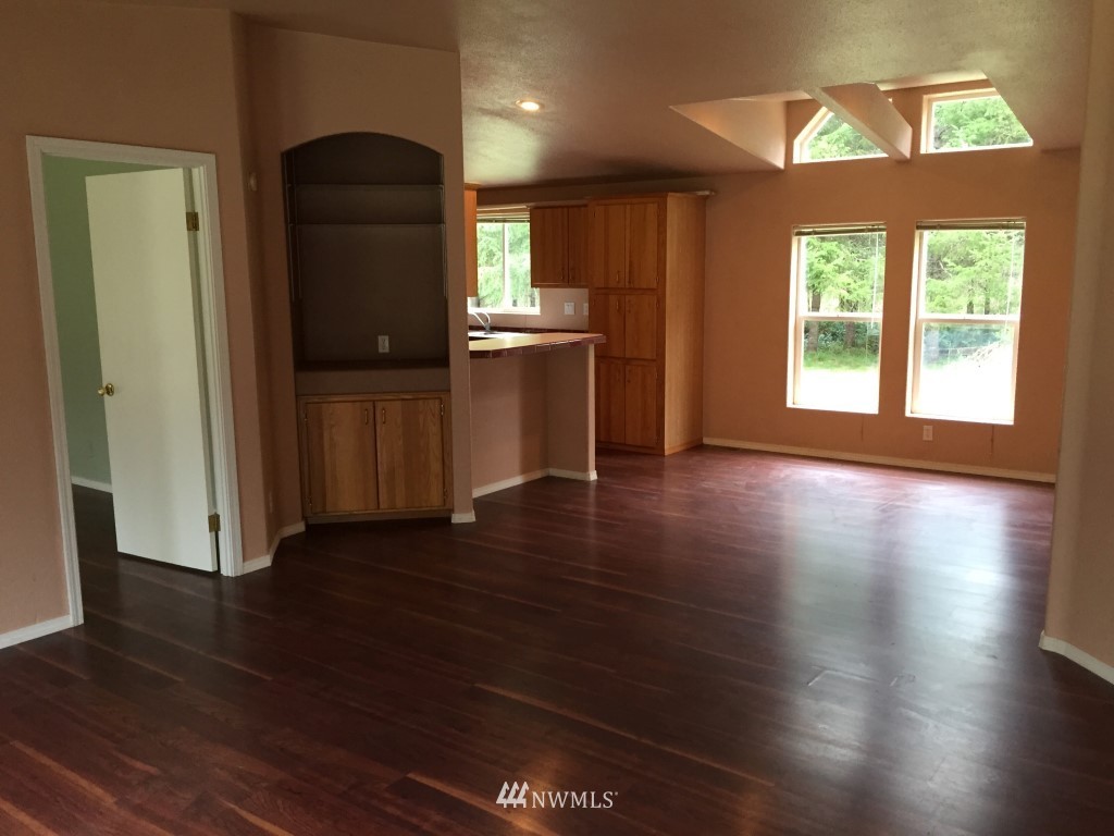 21922 Summers Road Centralia, WA 98531 - Photo 4 of 17 wooden floor in an empty room with a window