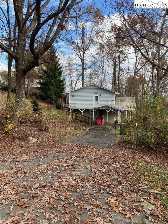 167 Grandridge Road Sparta, NC 28675 - Photo 5 of 29 a view of a house with a yard and sitting area