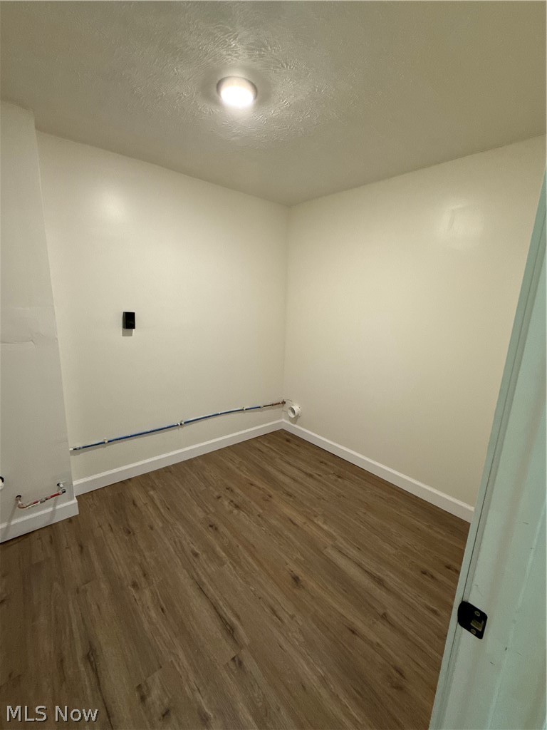 4841 Marigold Road Mentor, OH 44060 - Photo 12 of 12 Utility space featuring wood-finish flooring, white walls, and a ceiling-mounted light fixture