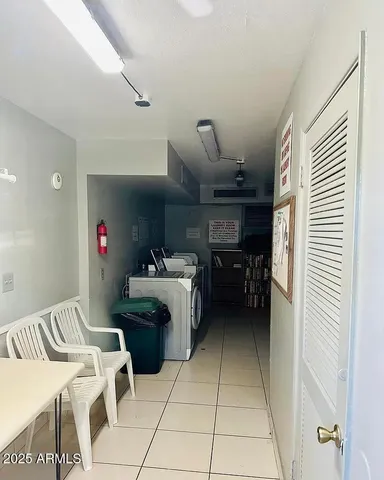 a kitchen with stainless steel appliances kitchen island granite countertop a refrigerator and a stove