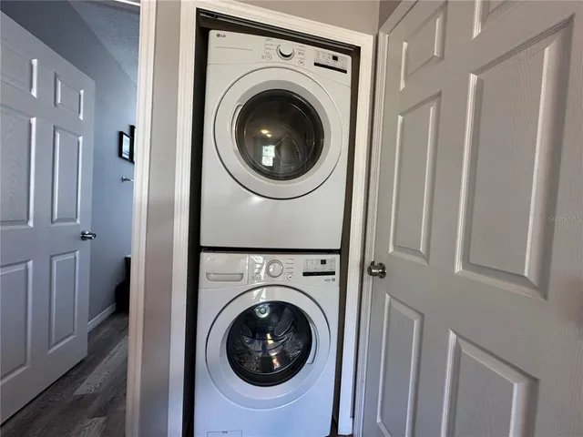 a view of a hallway with washer and dryer