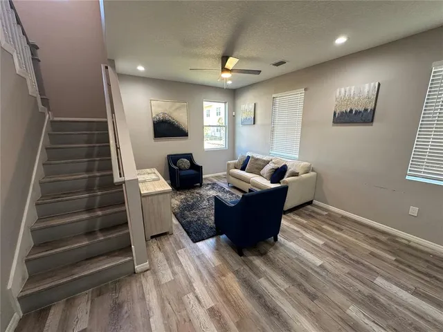 a living room with furniture and a window
