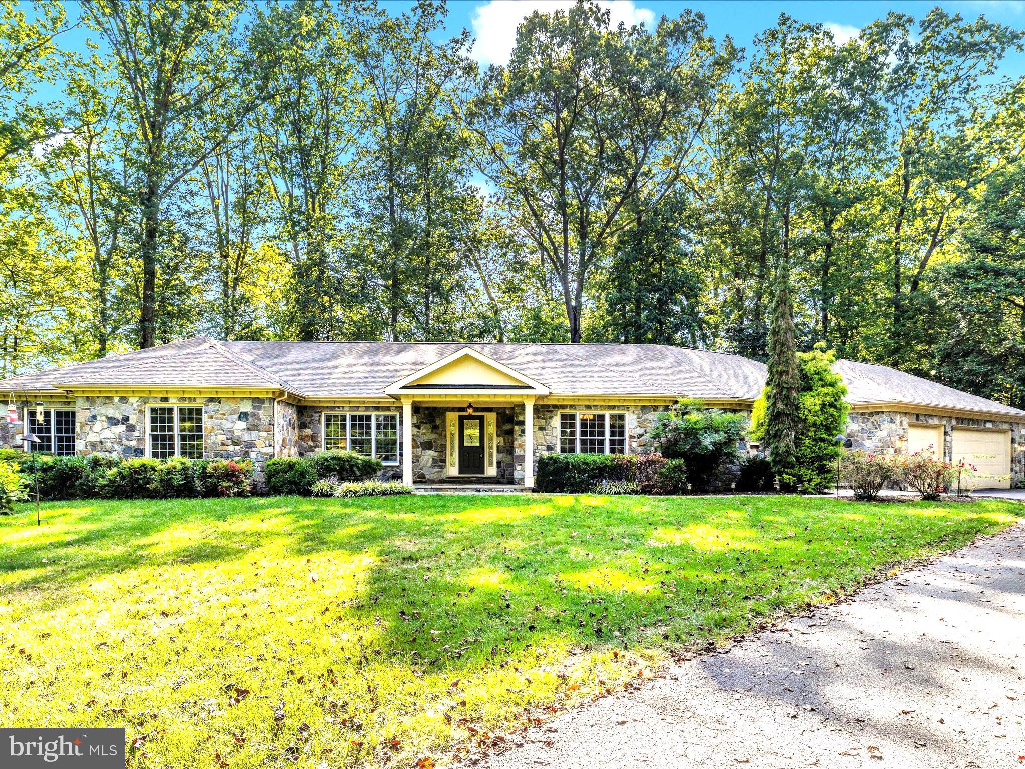 Classic stone front with 3 car garage