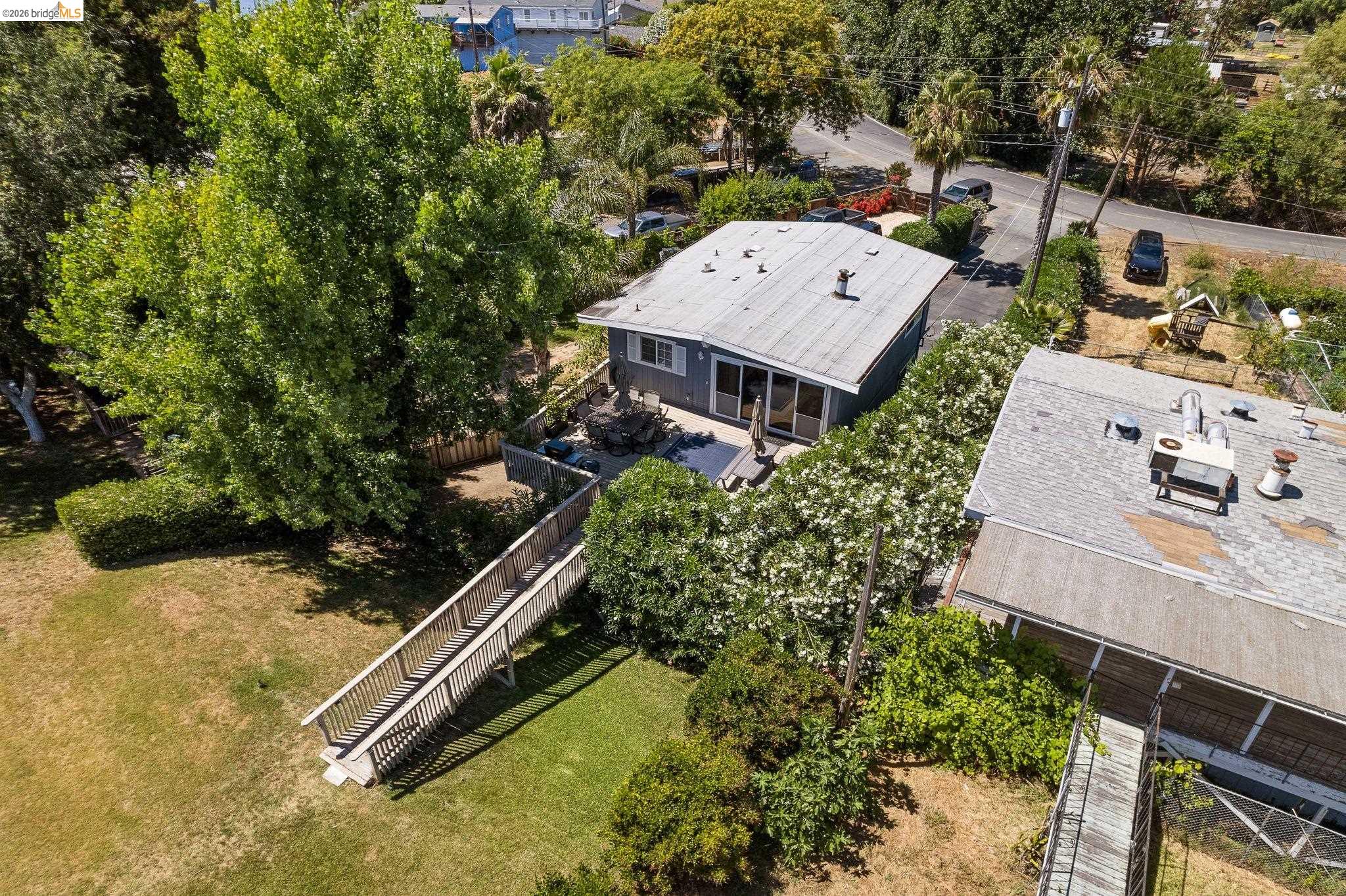 1704 Taylor Road Bethel Island, CA 94511 - Photo 52 of 73 Aerial perspective showcasing a single-story dwelling with a light-colored roof