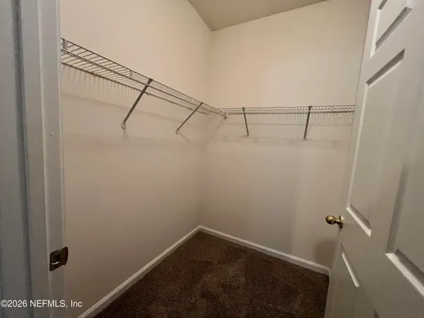a view of small space with racks on the wall