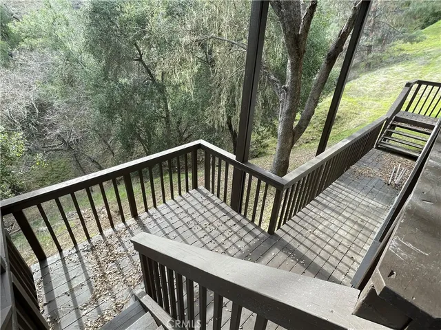 a view of balcony with wooden floor