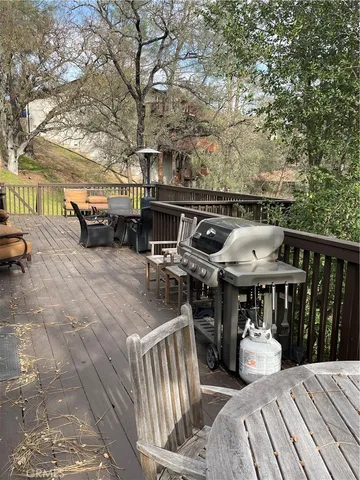 a view of a chairs and tables in the balcony