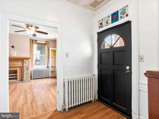 a view of a hallway view with wooden floor and staircase