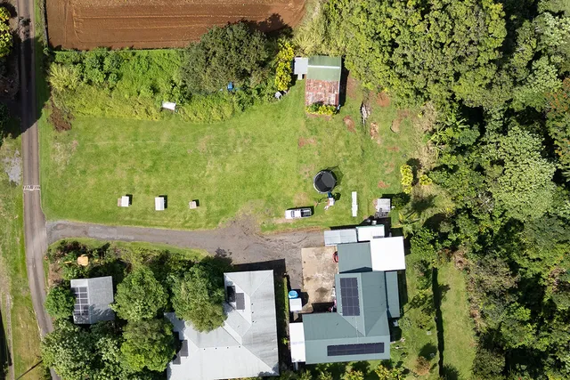 an aerial view of a residential apartment building with a yard
