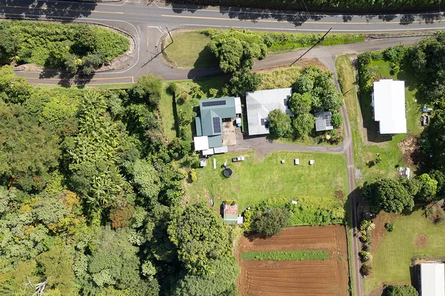 an aerial view of a house with a garden