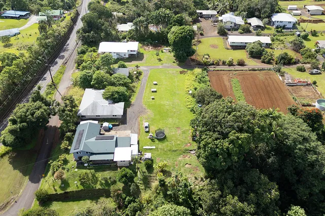 an aerial view of residential house with swimming pool