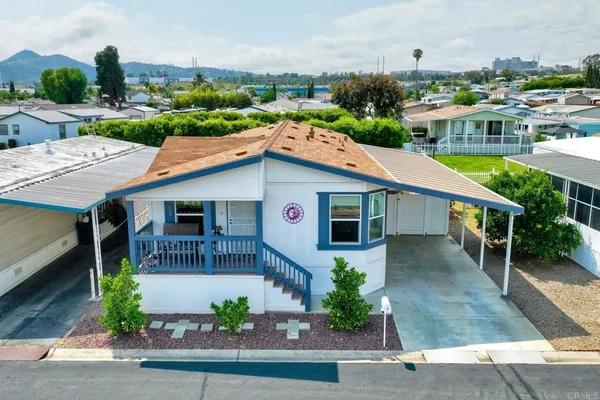 an aerial view of a house with a yard