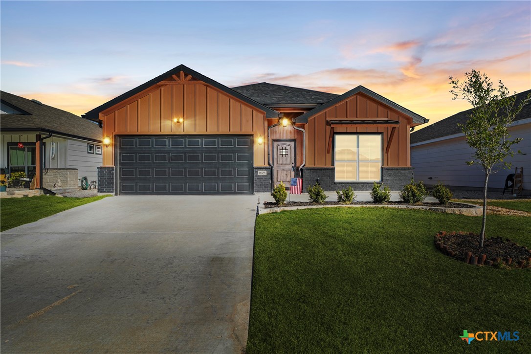 a front view of house with yard and green space