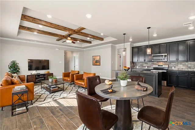 a view of a dining room with furniture