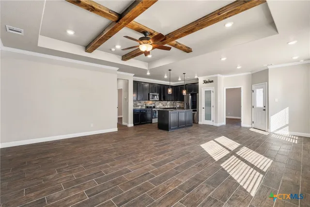 a view of a livingroom with a kitchen
