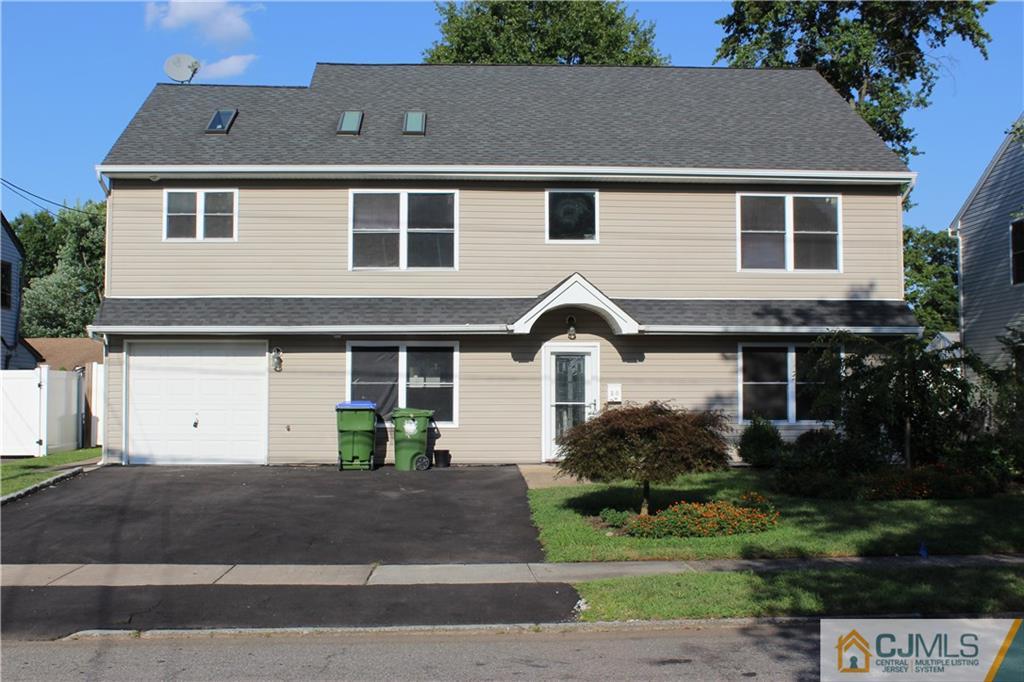 15 Kenmore Road Edison, NJ 08817 - Photo 1 of 35 a front view of house with yard and green space