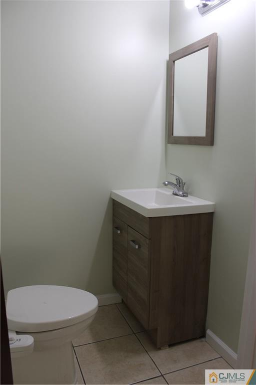 15 Kenmore Road Edison, NJ 08817 - Photo 18 of 35 a bathroom with a sink toilet and mirror
