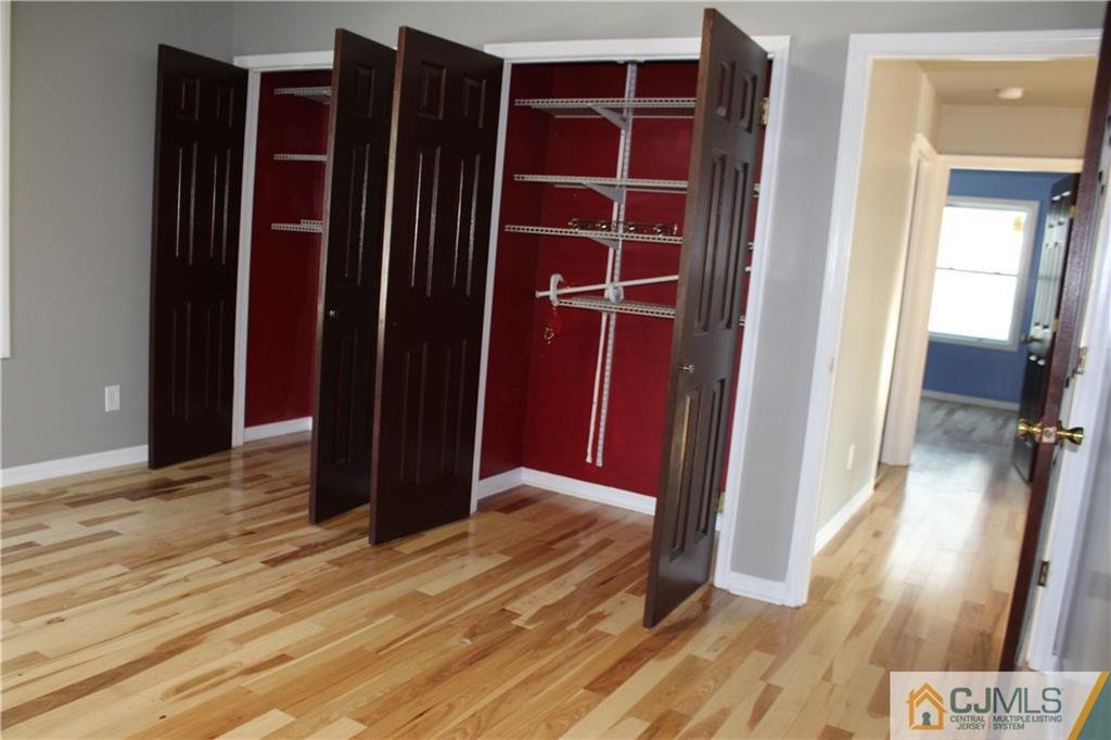 15 Kenmore Road Edison, NJ 08817 - Photo 22 of 35 a view of hallway with wooden floor