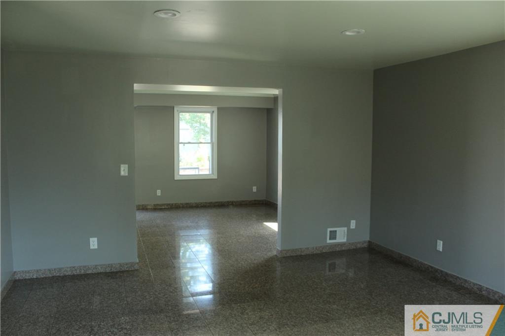 15 Kenmore Road Edison, NJ 08817 - Photo 5 of 35 a view of empty room with window