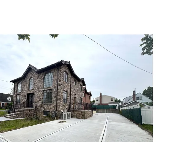 a view of a street in front of a house