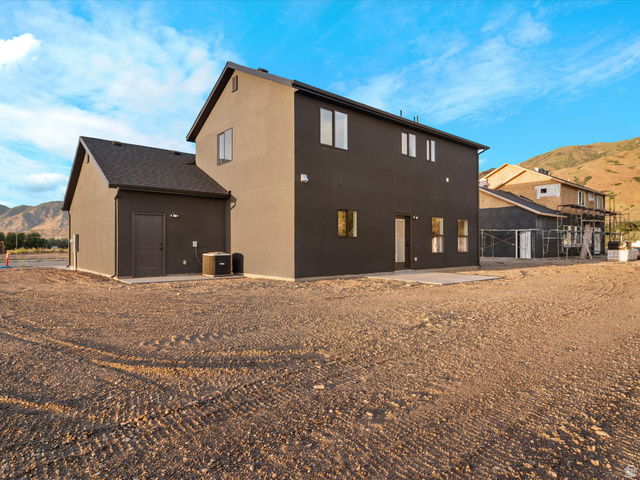 1267 West 2350 South Perry, UT 84302 - Photo 7 of 35 Contemporary two-story exterior with dark grey siding and dark asphalt shingle roofing