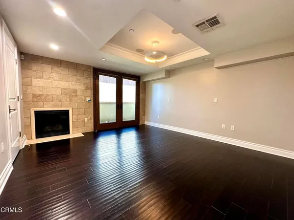 a bathroom with a sink a large mirror and a shower
