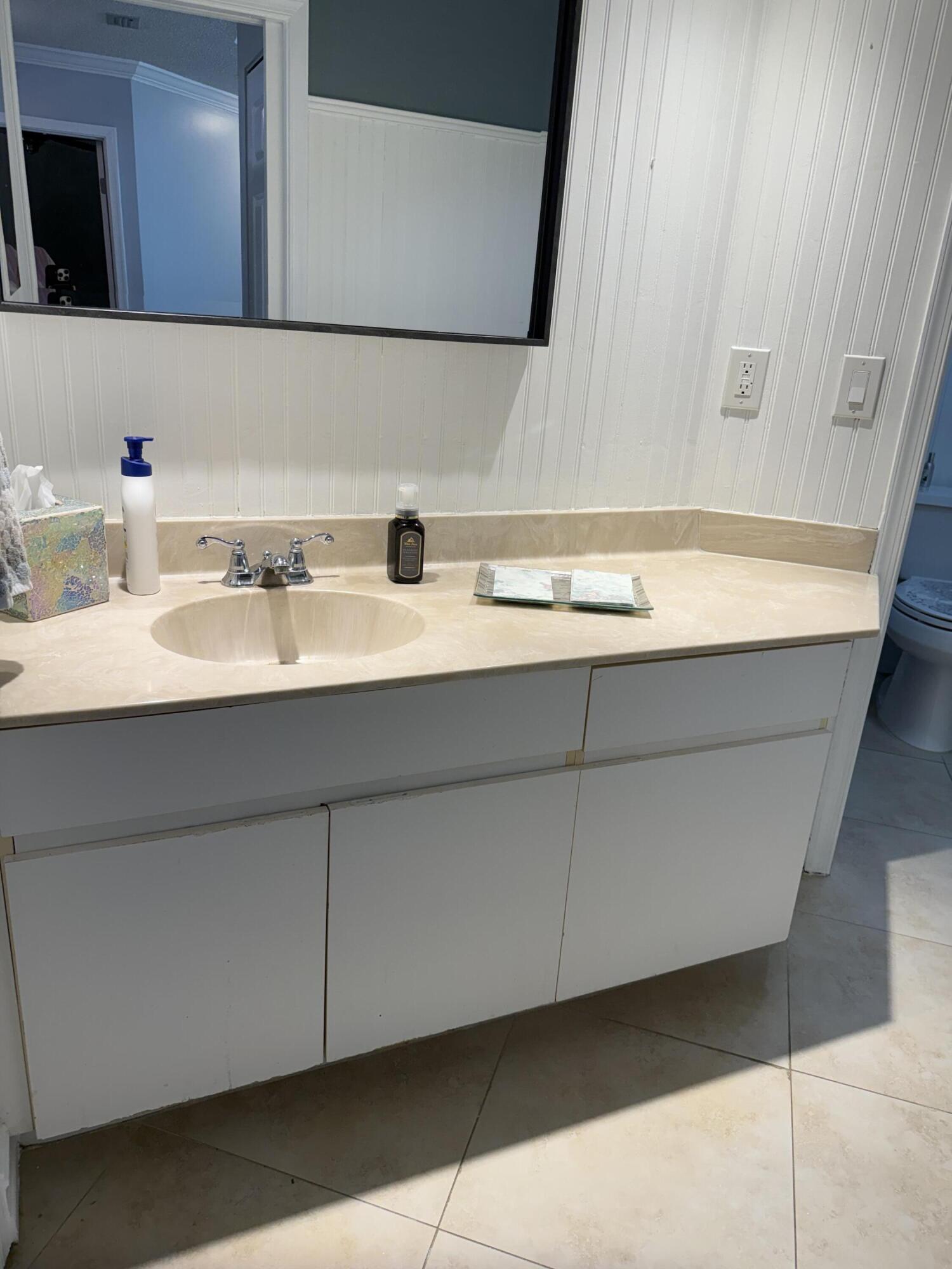 21583 Villa Nova Drive Boca Raton, FL 33433 - Photo 17 of 33 a bathroom with a sink and a mirror