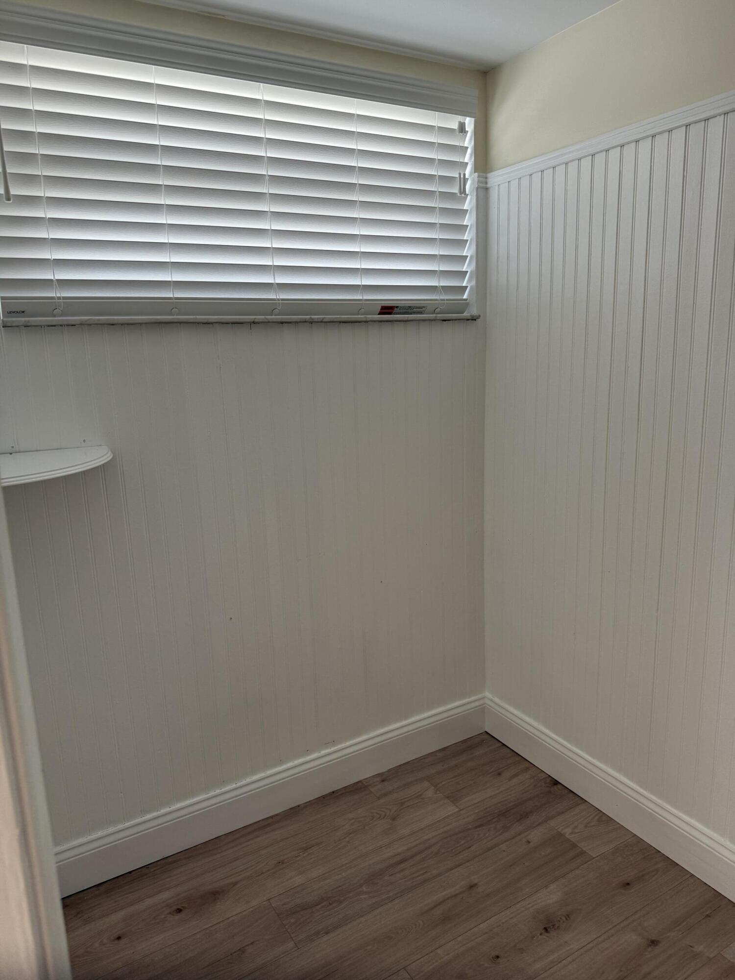 21583 Villa Nova Drive Boca Raton, FL 33433 - Photo 20 of 33 a view of a small space with wooden floor and a window