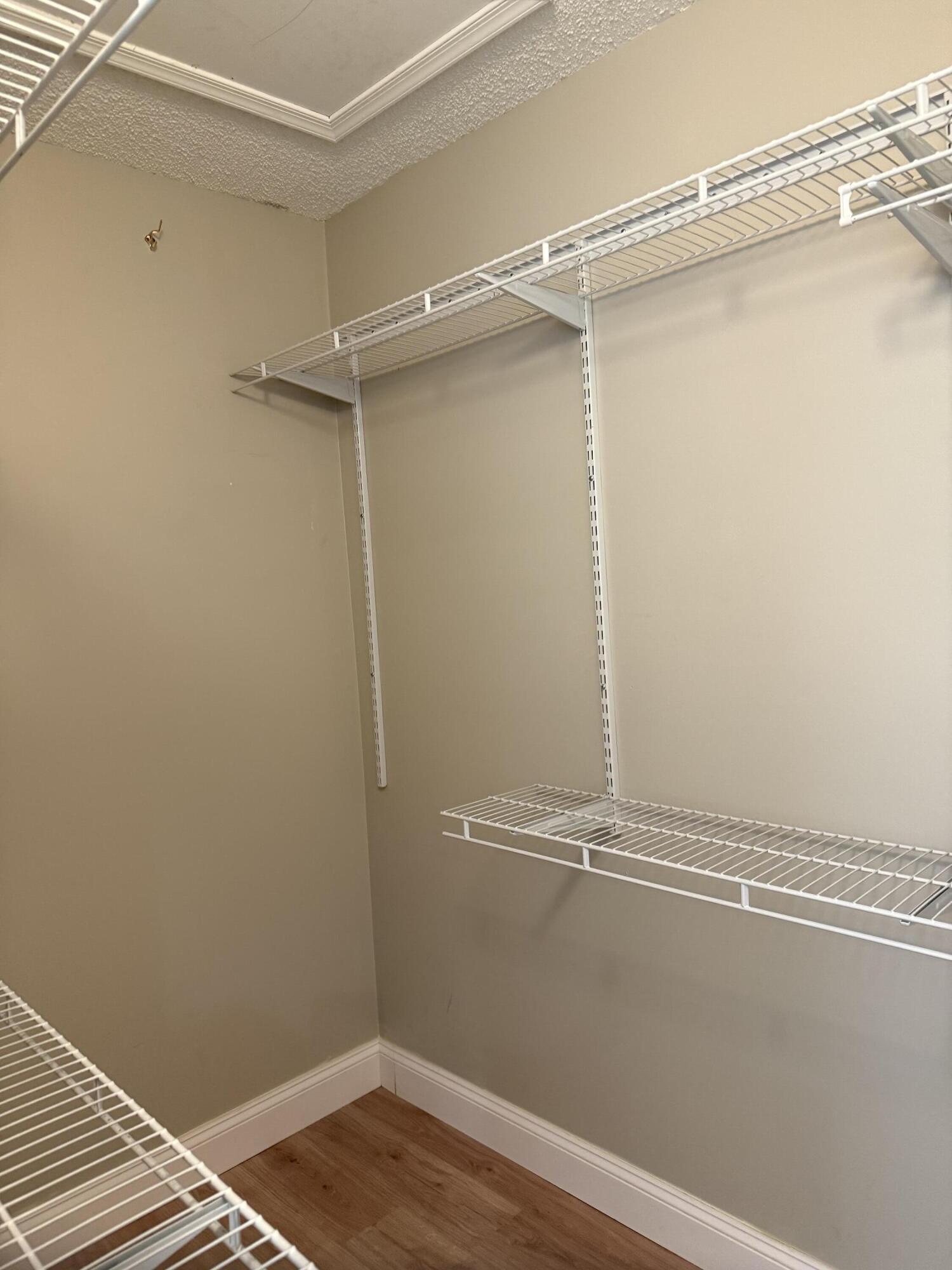 21583 Villa Nova Drive Boca Raton, FL 33433 - Photo 25 of 33 a view of a room with racks on the wall