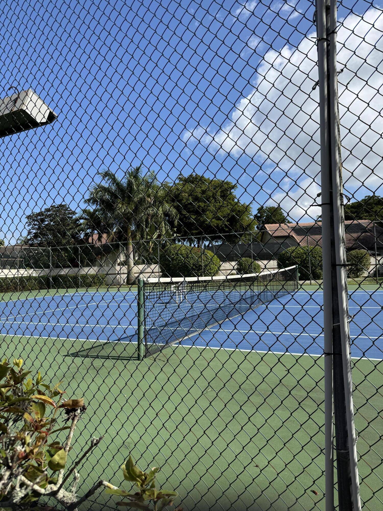 21583 Villa Nova Drive Boca Raton, FL 33433 - Photo 33 of 33 a view of a yard and a building