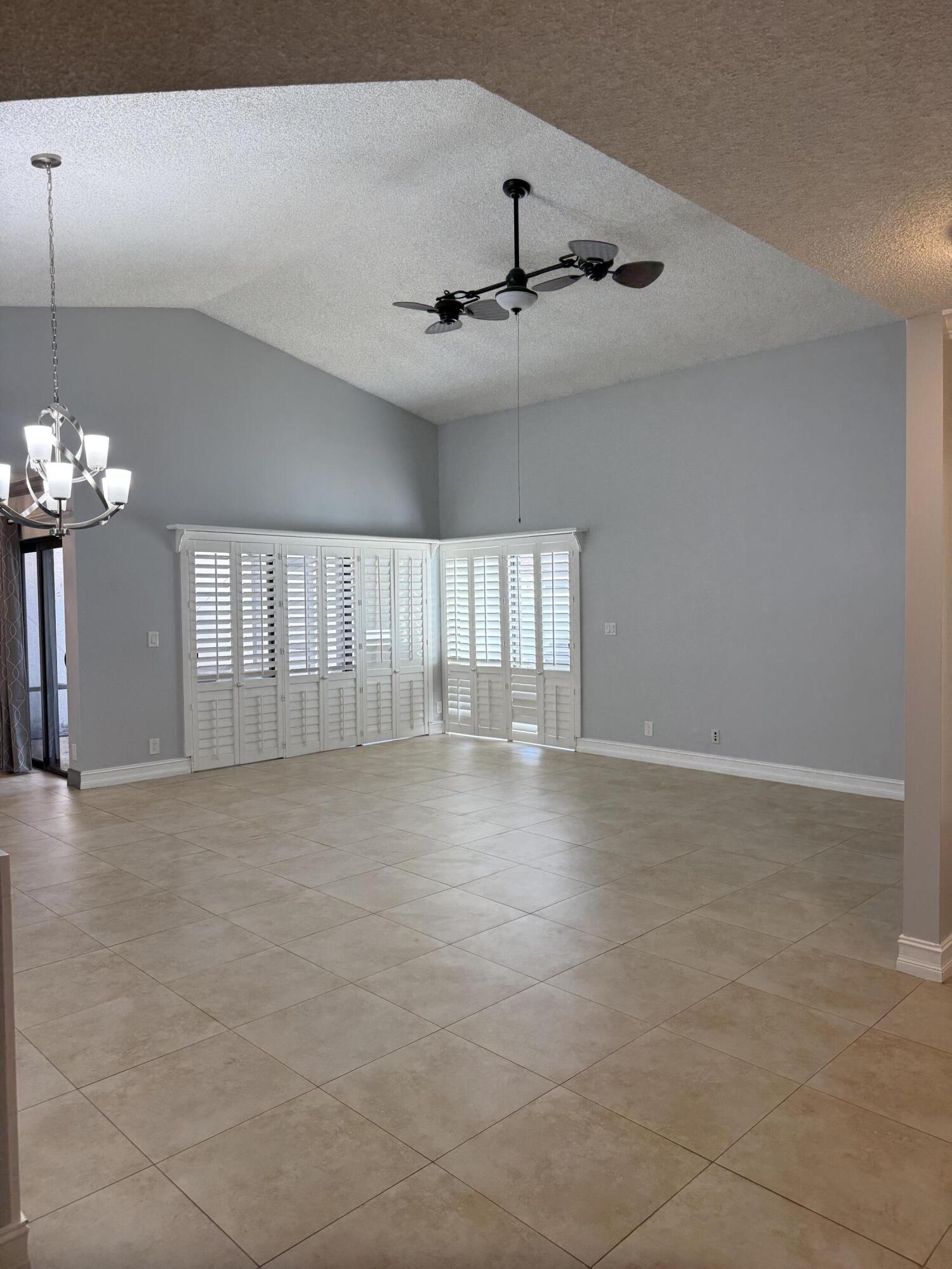 21583 Villa Nova Drive Boca Raton, FL 33433 - Photo 4 of 33 a view of an empty room with a window