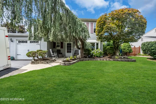 a view of a chair and table in the garden
