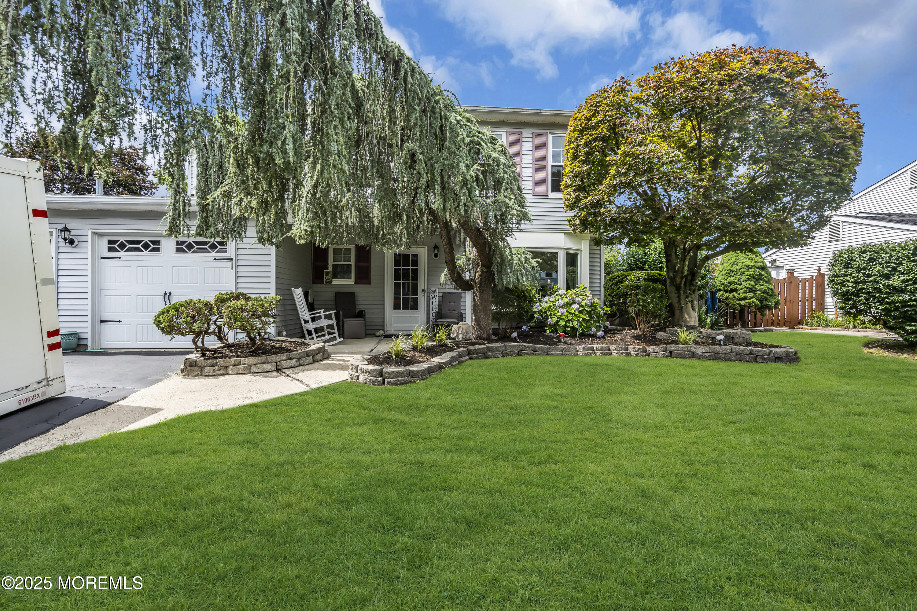 a view of a chair and table in the garden