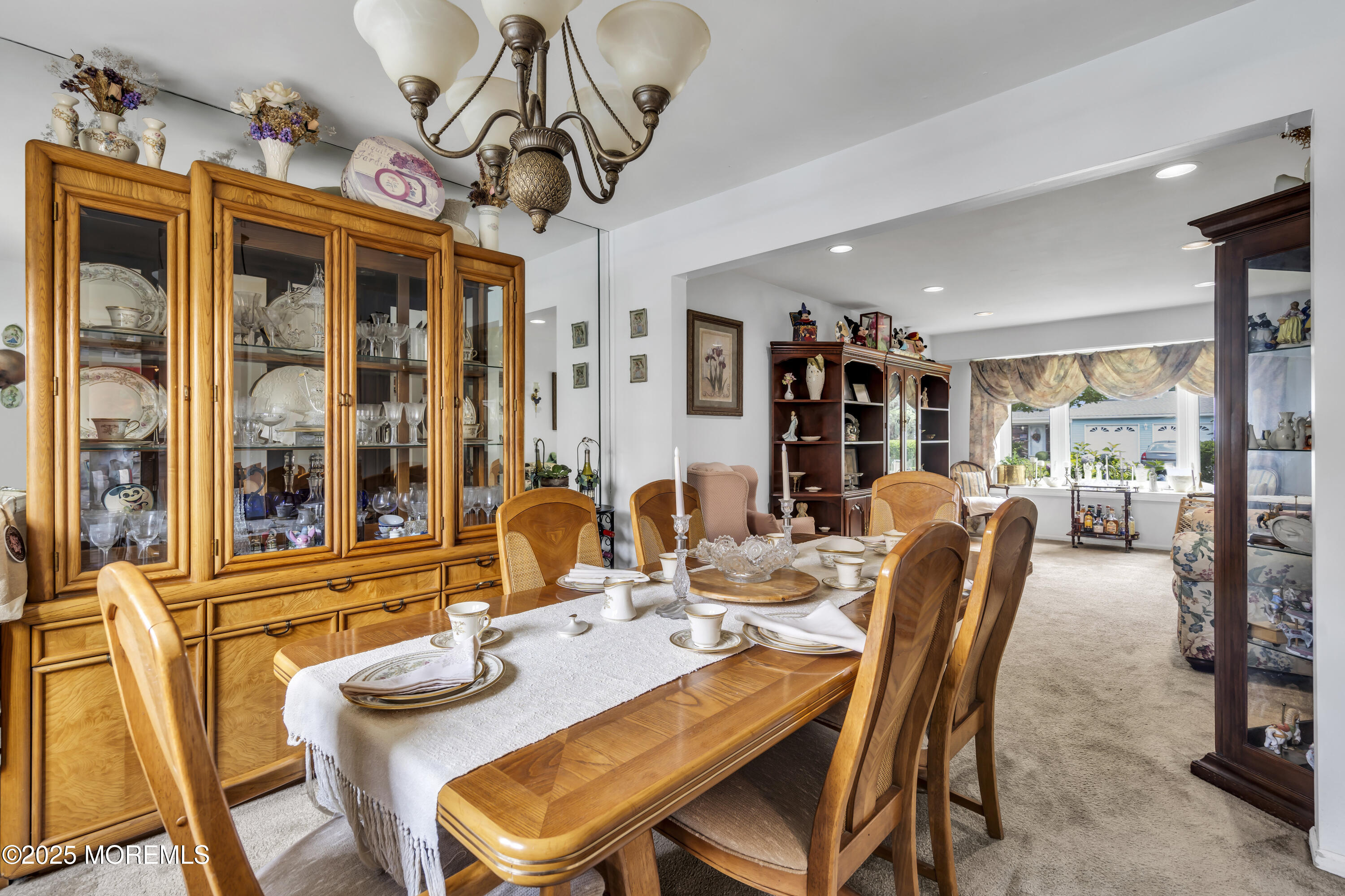 9 Yellowstone Lane Howell, NJ 07731 - Photo 18 of 37 a dining room with furniture a chandelier and window