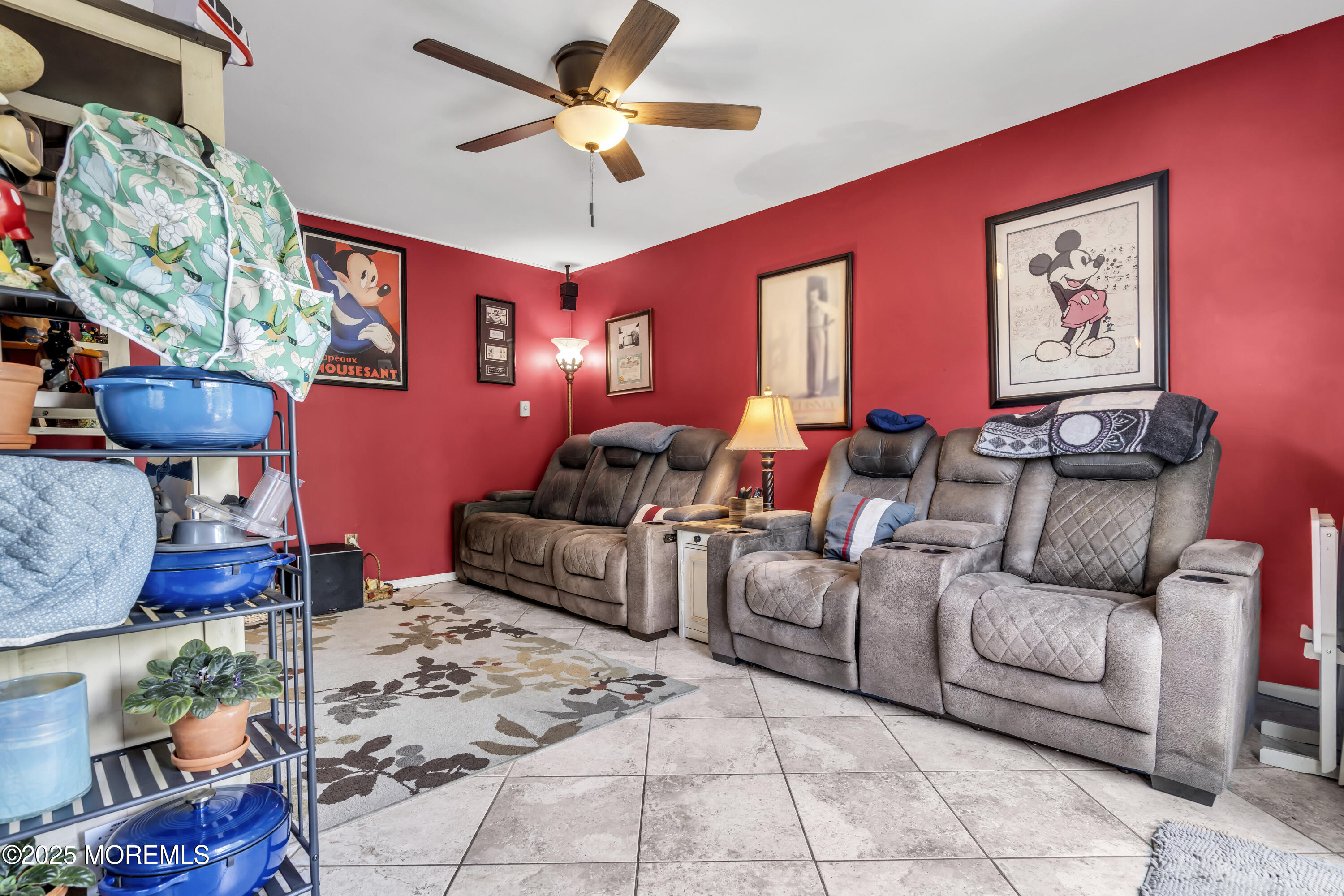 9 Yellowstone Lane Howell, NJ 07731 - Photo 20 of 37 a living room with furniture a chandelier and a flat screen tv