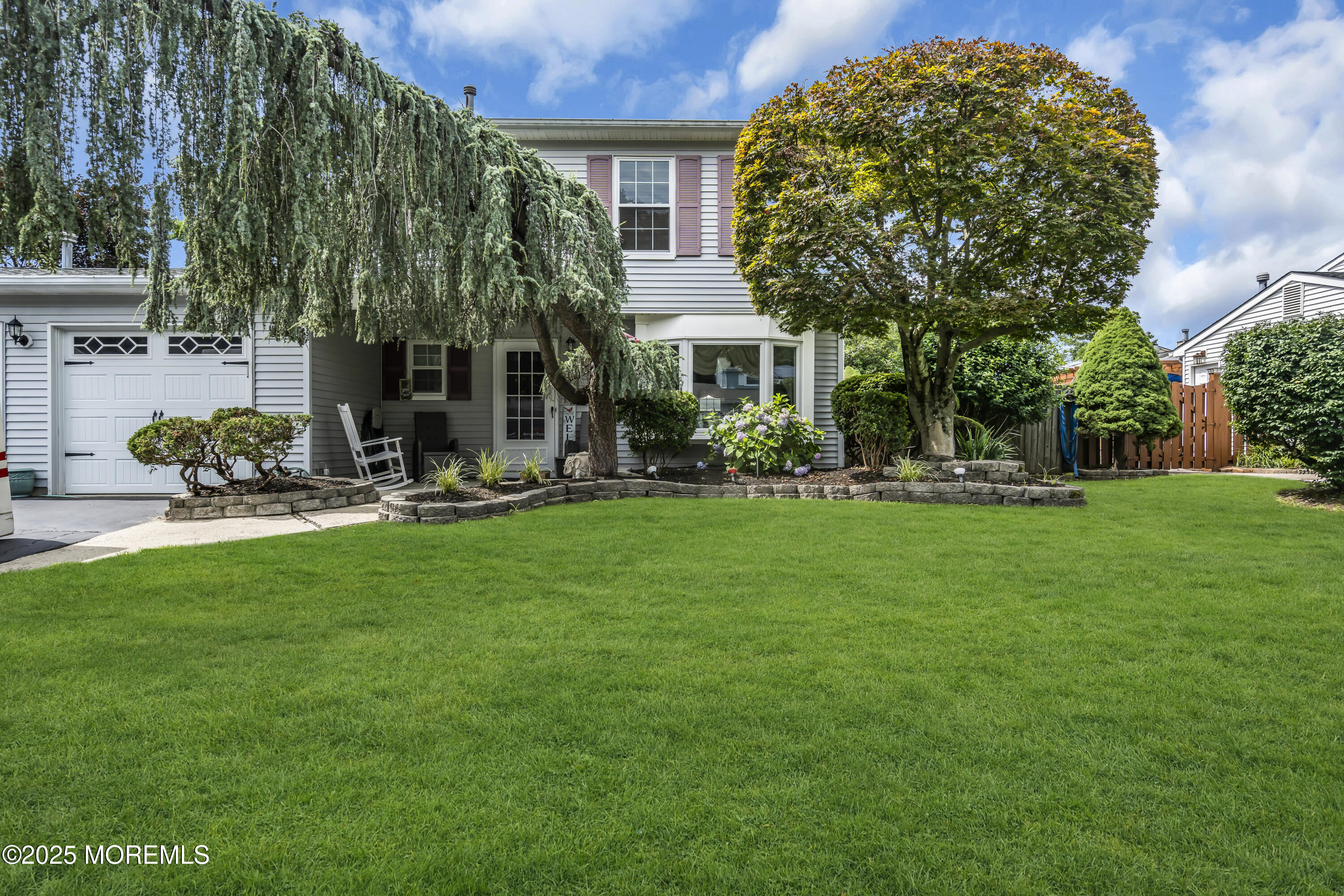 9 Yellowstone Lane Howell, NJ 07731 - Photo 2 of 37 a front view of a house with garden