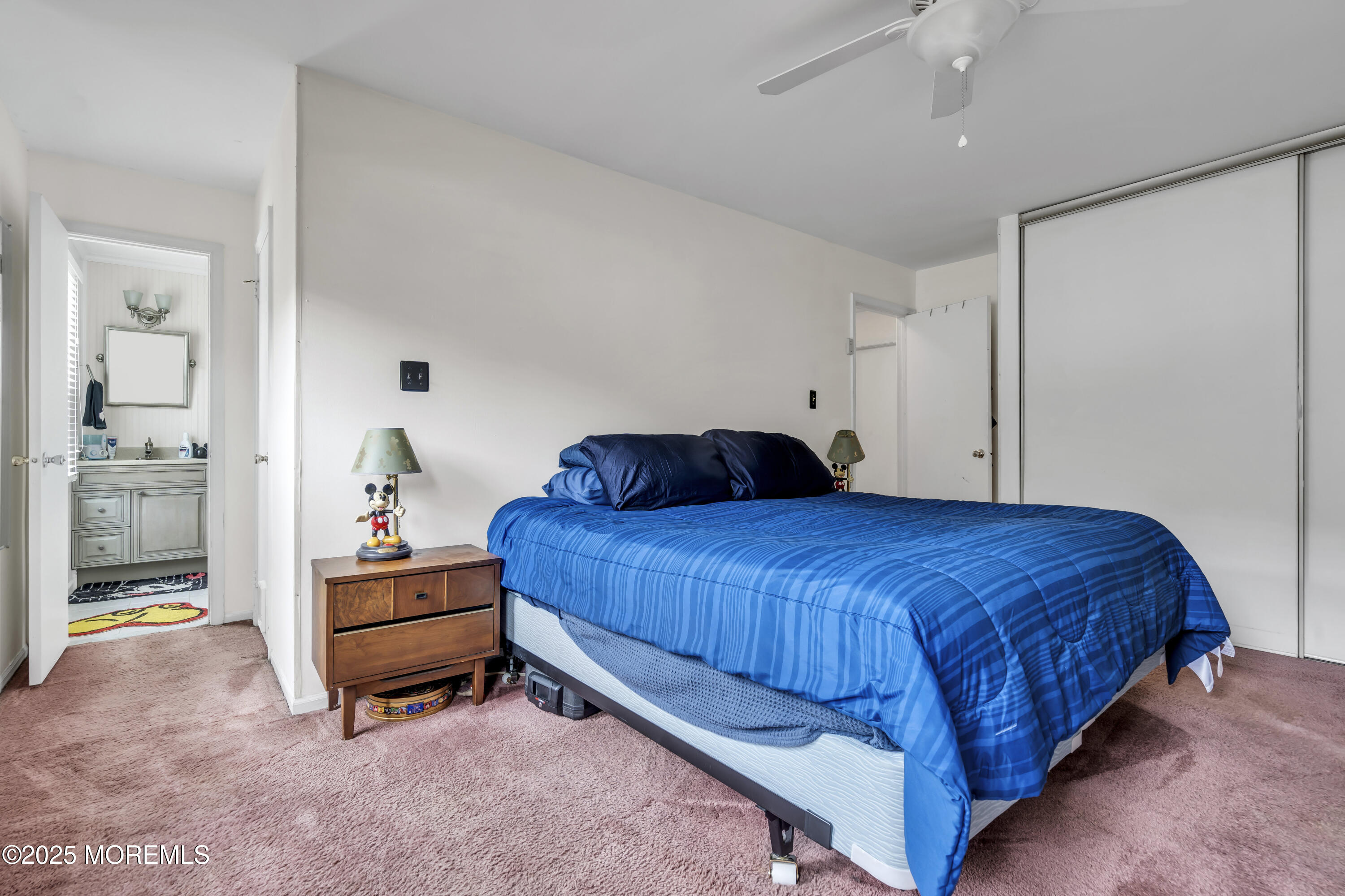 9 Yellowstone Lane Howell, NJ 07731 - Photo 23 of 37 a bedroom with a bed and a table