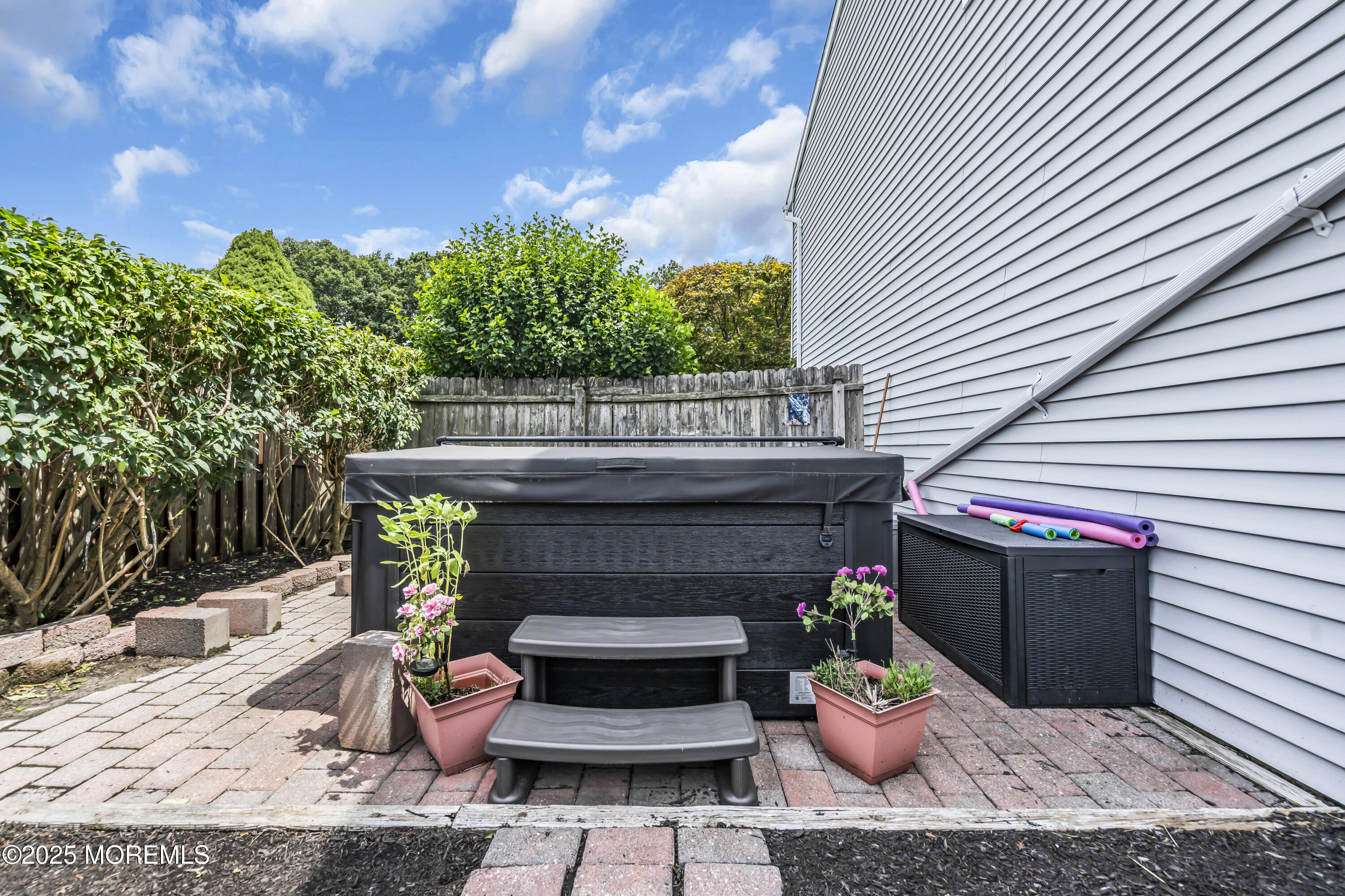 9 Yellowstone Lane Howell, NJ 07731 - Photo 31 of 37 a view of a patio with couches chairs and potted plants