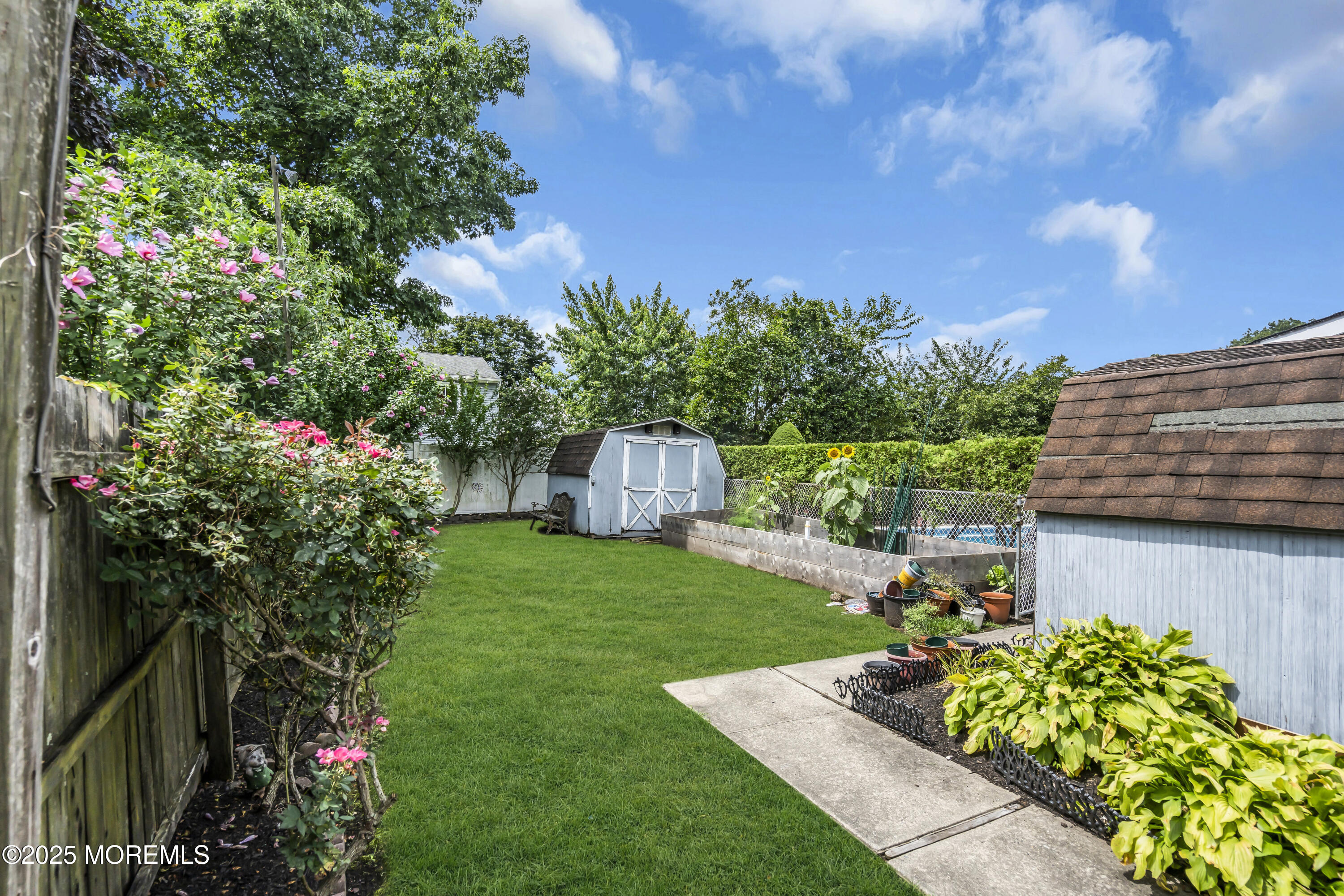 9 Yellowstone Lane Howell, NJ 07731 - Photo 32 of 37 a view of a house with a yard and garden