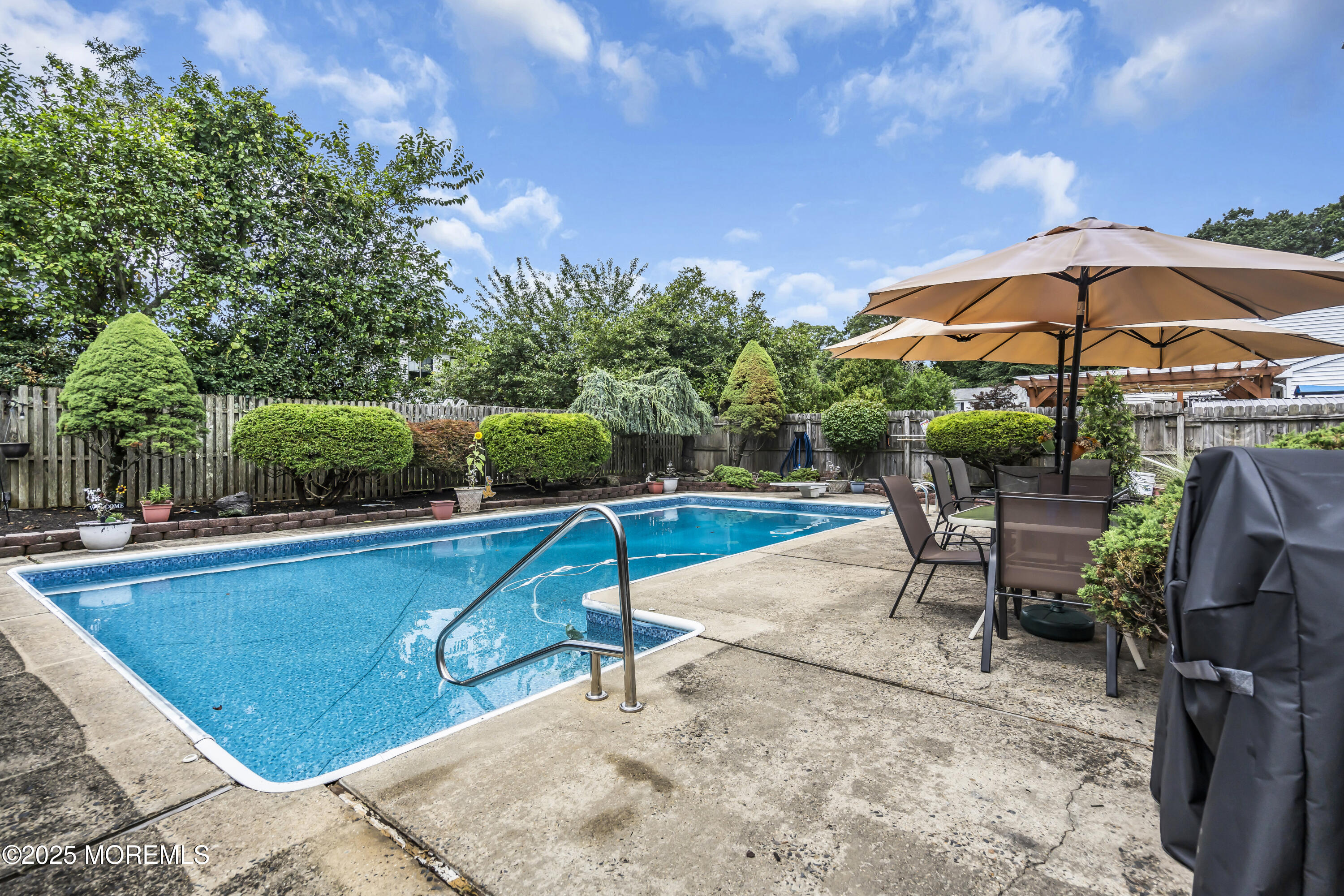 9 Yellowstone Lane Howell, NJ 07731 - Photo 34 of 37 a view of a swimming pool with a patio