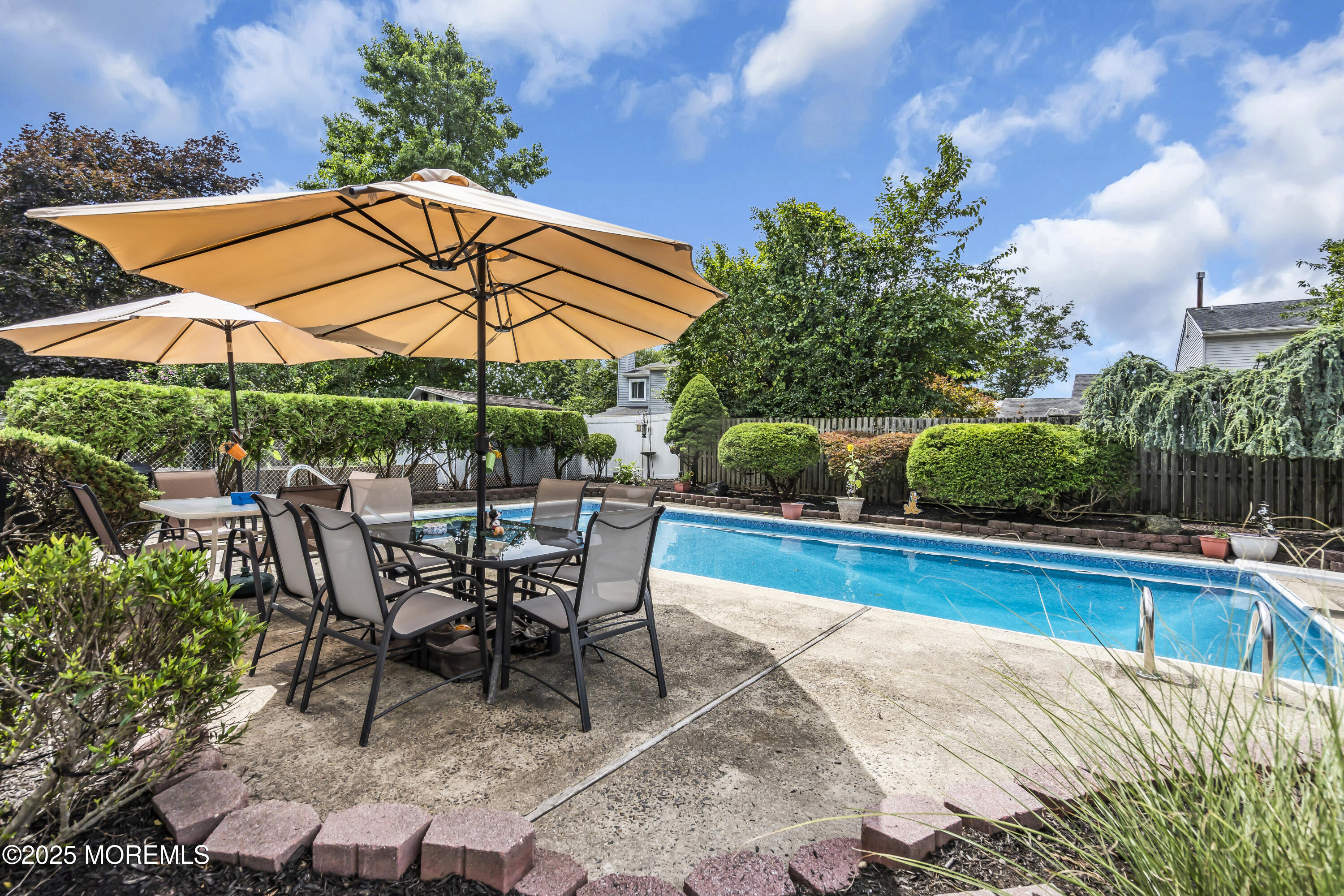9 Yellowstone Lane Howell, NJ 07731 - Photo 37 of 37 a view of a swimming pool with a patio