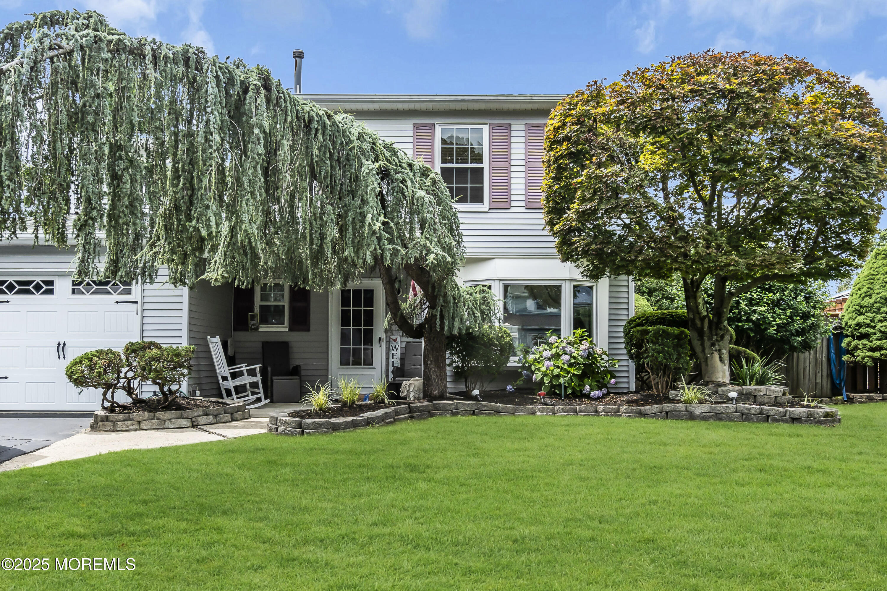 9 Yellowstone Lane Howell, NJ 07731 - Photo 4 of 37 a view of a house with backyard and a tree