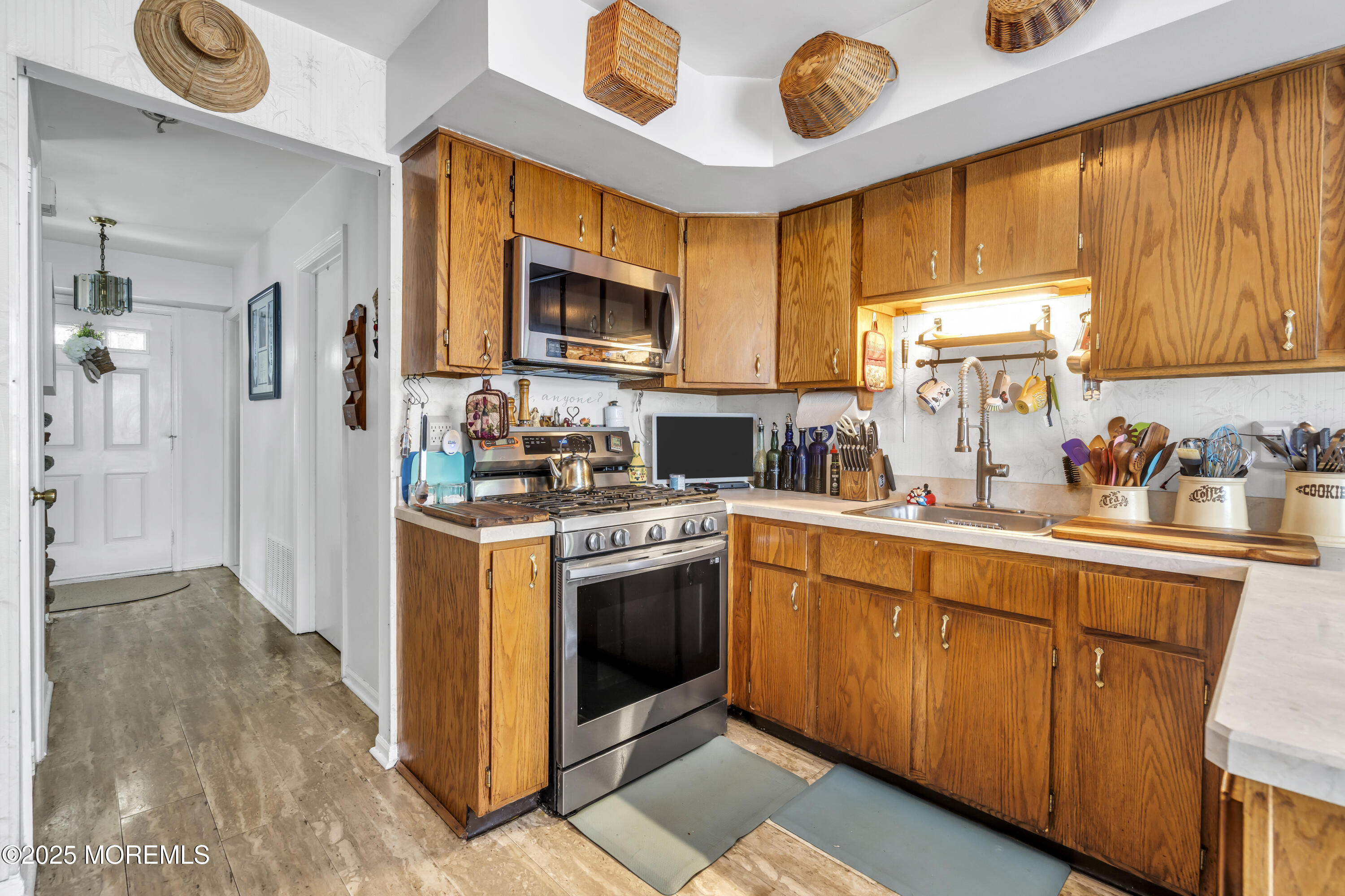 9 Yellowstone Lane Howell, NJ 07731 - Photo 7 of 37 a kitchen with stainless steel appliances granite countertop a stove a sink and a microwave