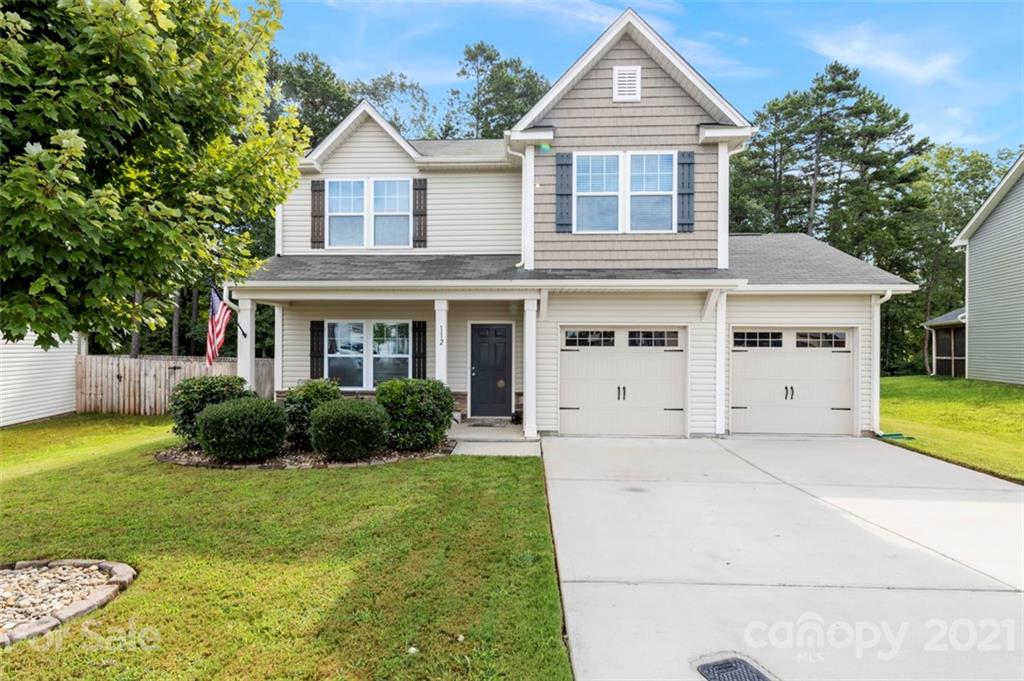 112 Tranquil Court Locust, NC 28097 - Photo 1 of 25 a front view of a house with a yard