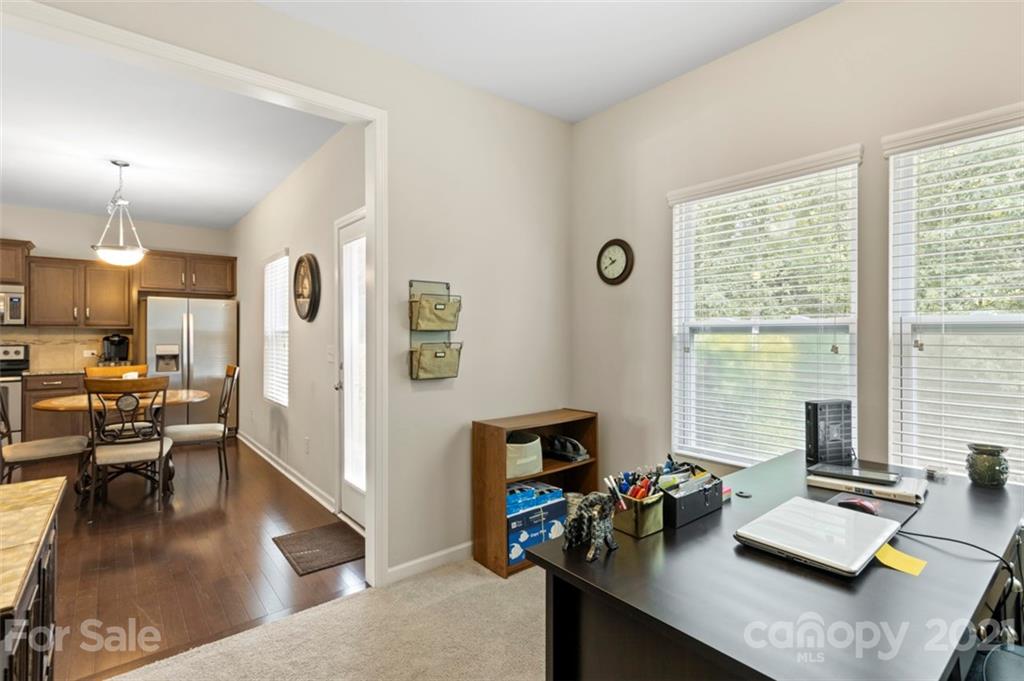 112 Tranquil Court Locust, NC 28097 - Photo 11 of 25 a view of a workspace with furniture and a window