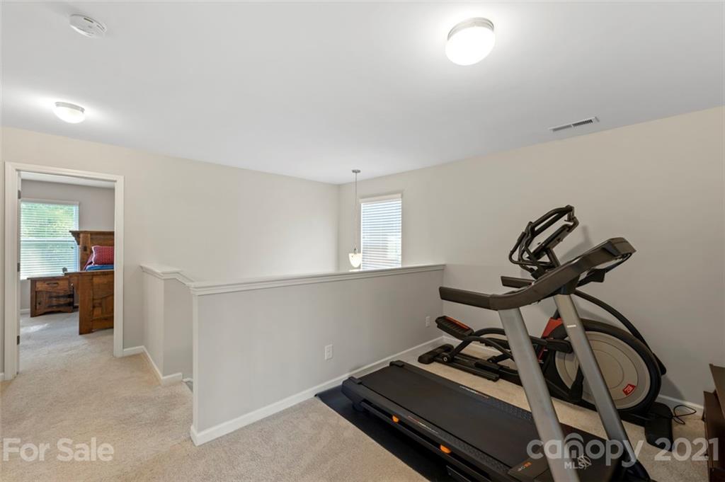 112 Tranquil Court Locust, NC 28097 - Photo 13 of 25 a view of a room with gym equipment